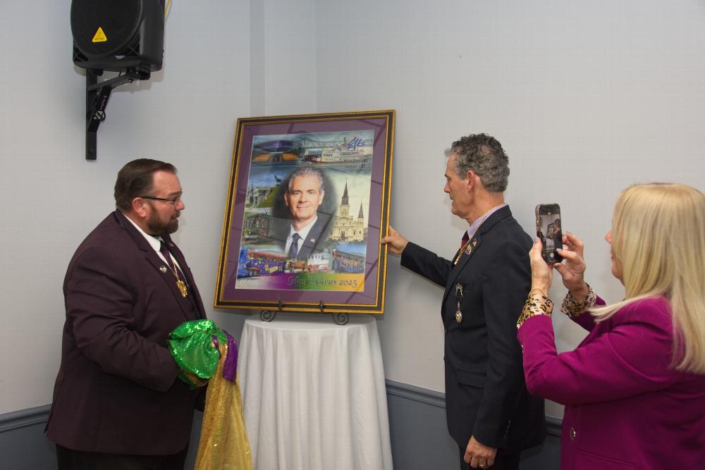 GER Schiefer being presented with his Mardi Gras Portrait from the members of New Orleans Lodge #30 