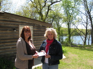 Check being presented to Pretty Lake Camp
