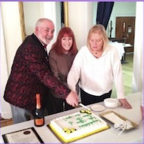 Brian, Faith & ER Joanne cut the cake for the party