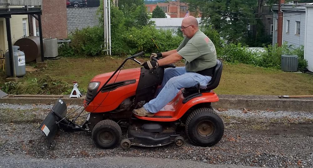 Keith Campbell crossing the finish line during lodge work day 2017