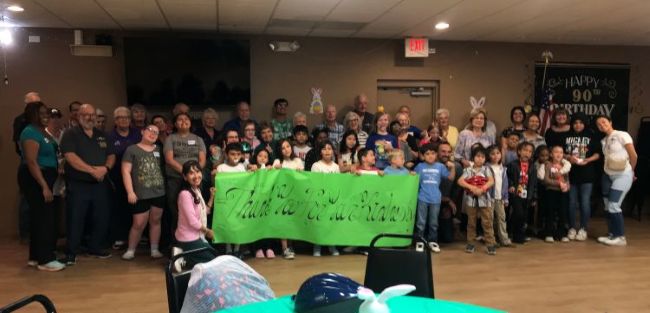 On March 29, 2025, 17 Elk members and 8 volunteers from Tucson AZ #385 took 25 young students with four teachers from Nash Elementary
School on a shopping spree to JC Penny’s. Back at the Lodge, volunteers prepared lunch to welcome these young students!

Two 6-year-old little girls lead the Pledge of Allegiance flag. The Easter Bunny handed out backpacks full of school supplies,
coloring books, sketch pad, crayons and color pencils; they also received handmade pillowcases with pillows, Easter
Baskets full of small toys, a toothbrush/toothpaste, Easter candy, & a stuffed animal.

Each child was fitted with a helmet and received  a bicycle from the Lodge #385 “Bike-in-Box’ program. We also celebrated a 7-year-old’s Birthday. 

Personal thanks to each Tucson Elks Lodge #385 member and Volunteer!  I greatly appreciate all the donations, Charity groups, Clubs and organizations that made
another event so successful!!

ER Richard Bernard on left with many Tucson Elks Lodge #385 members and officers.
Fraternally, 

Martha Megerle/Trustee
Clothe-A-Child Chairman