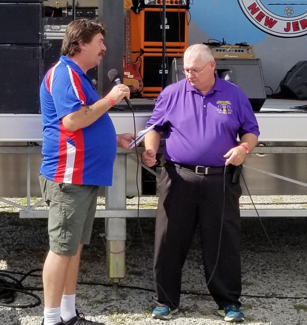 PDD William W. Dow Jr. presenting checks for the Army of Hope and Homeless Veterans Committees.