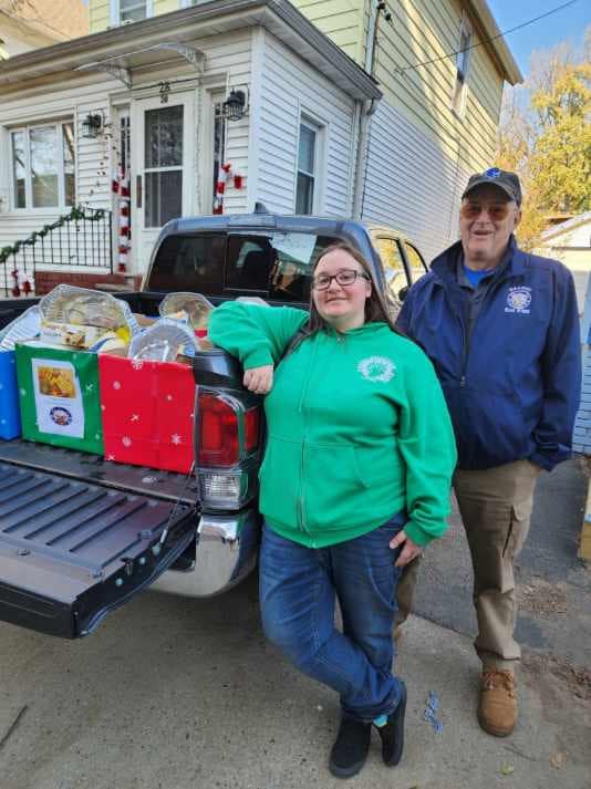 Donating Thanksgiving baskets to those in need.