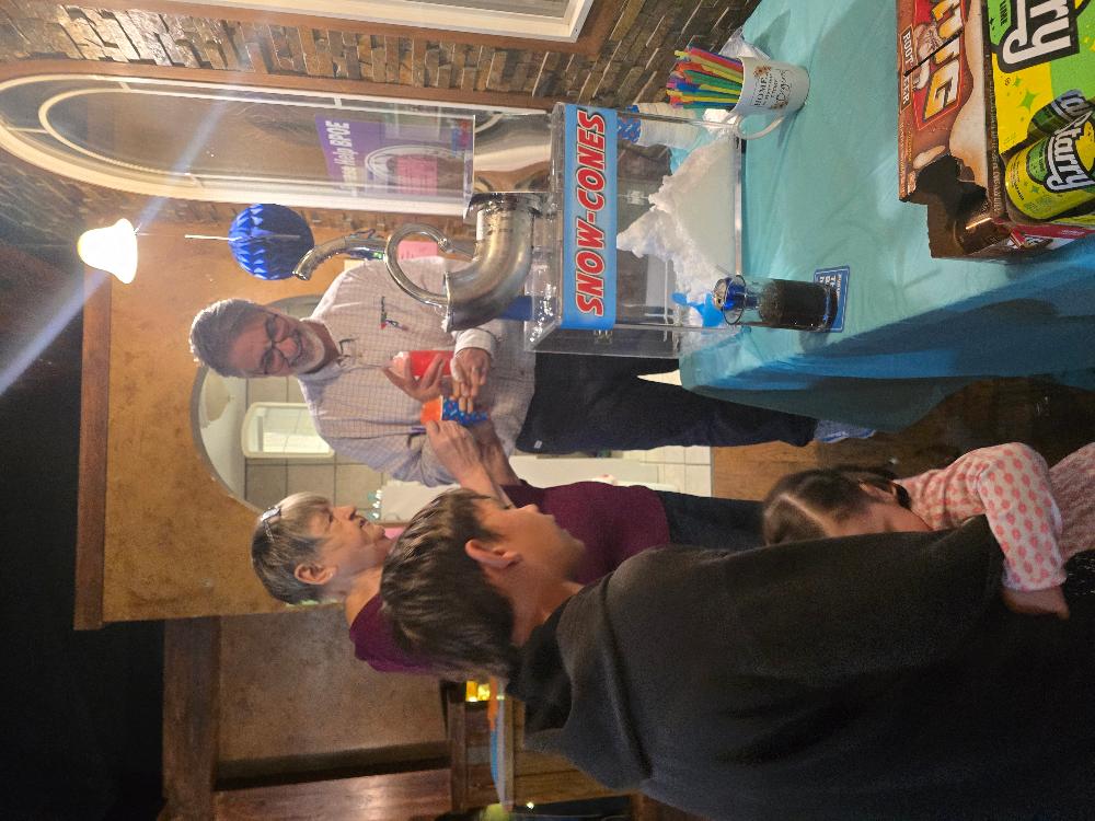 Mayor Kourianos and Cathy Rummel making snowcones. Cinco de Mayo Kid's Party