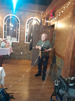 Jim Roybal taking photos