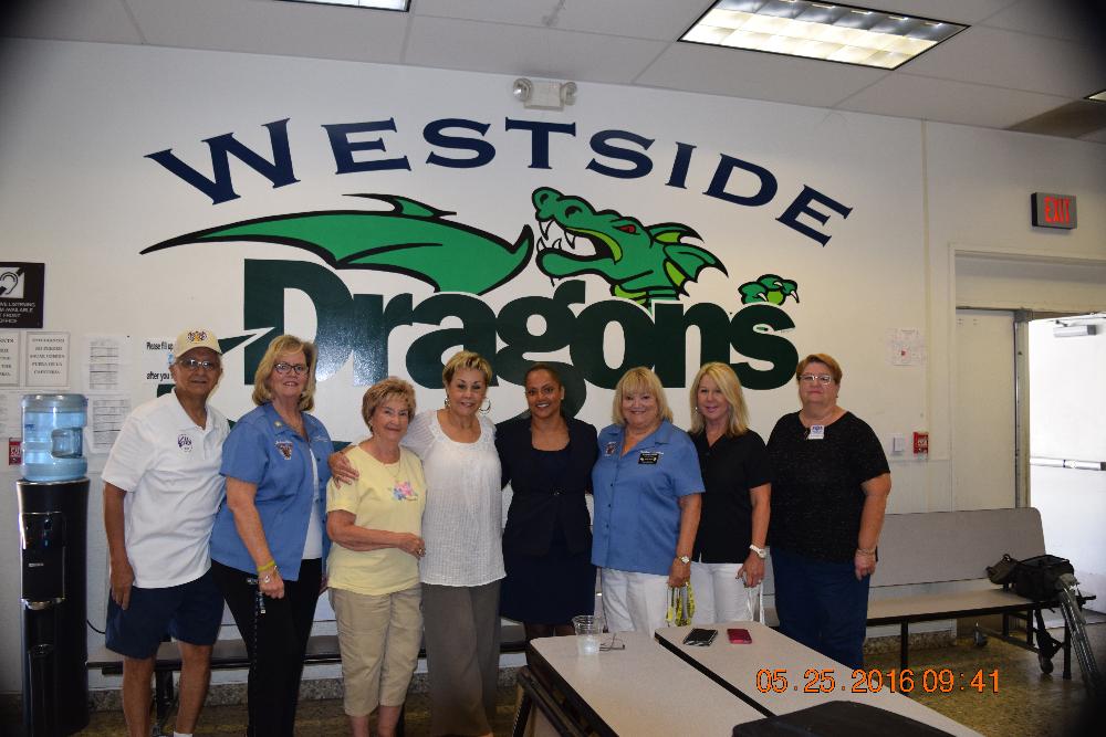 Donating sports equipment to Westside Elementary School