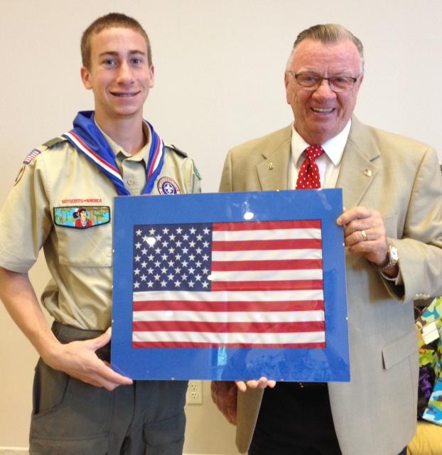 Edward Larsen, Eagle Scout, is presented a framed flag from the Naples Elks Lodge by Ray Honan, ER.  The occasion took place at Edward's 'Court of Honor', on Jan 17, 2015. The Naples Elks sponsors Edward's Boy Scout Troop.