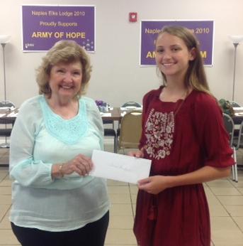 Donna Fiala presenting Tarah Gantzertb 2nd  Place in Division ll (7th & 8th)of this year's State Americanism Essay Contest sponsored by the Florida Elks