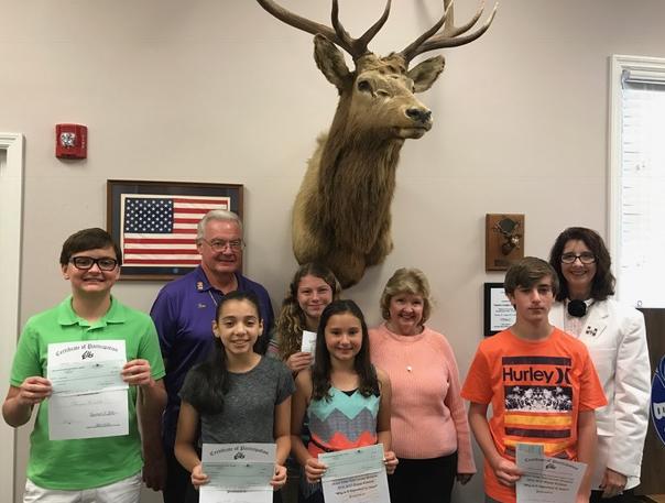 Here of five  the six winners of the Naples Lodge Americanism Essay Contest. They are accompanied by District Vice President Ron Heldebrant, Collier County Donna Fiala and Exalted Ruler Mary Jo Wojciechowski. Anna Marie Honan chaired the Committee. All essays are forwarded to the district for further review and forwarding.