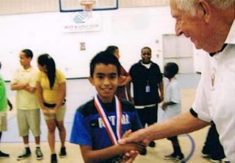 Jim Hoffman congratulating a winner!   Hoop Shoot 2011