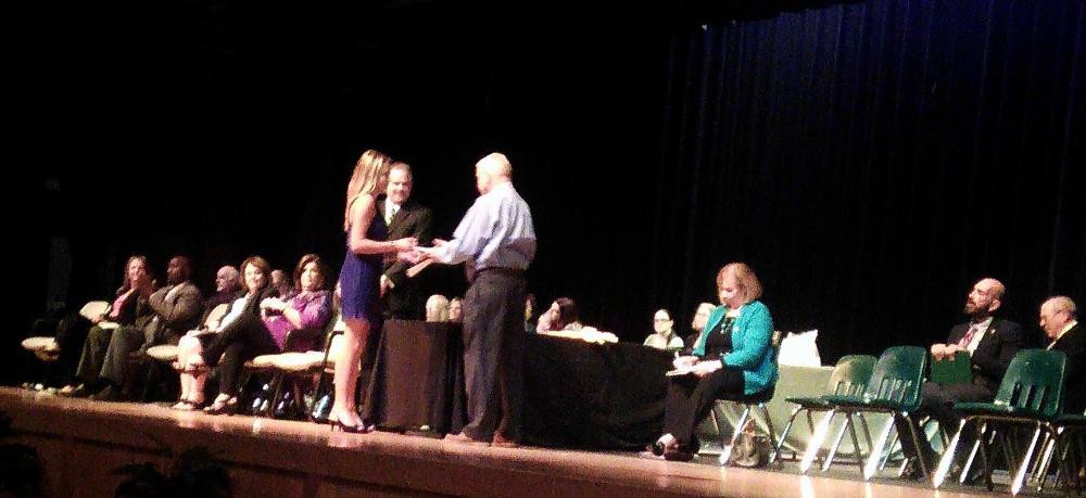 Jessica Rakich is presented with her Naples Elks Lodge Local Scholarship of $4,000, $1,000 per year over four years by David Woodworth, Scholarship Chairman, at Palmetto Ridge High Sch00l on May 12.  This award is part of the Most Valuable Student Scholarship program by The Elks National Foundation.