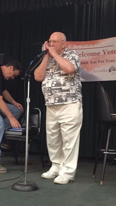 One of the Veterans Played Some Patriotic Songs on the Harmonica.