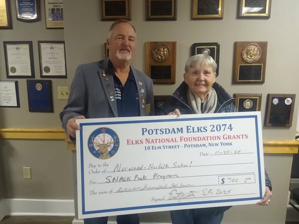 Potsdam Lodge #2074 has supported the Norwood Norfolk Central School Snack Pack Program with a $700 donation. The NNCS Snack Pack Program provides a weekend snack pack to 193 students. The Lodge used the proceeds from an Elks National Foundation Gratitude Grant to support the donation. Exalted Ruler Ernie Charleston is pictured presenting the donation on behalf of the Lodge to Mary Ellen Todd from the NNCS Snack Pack Program.