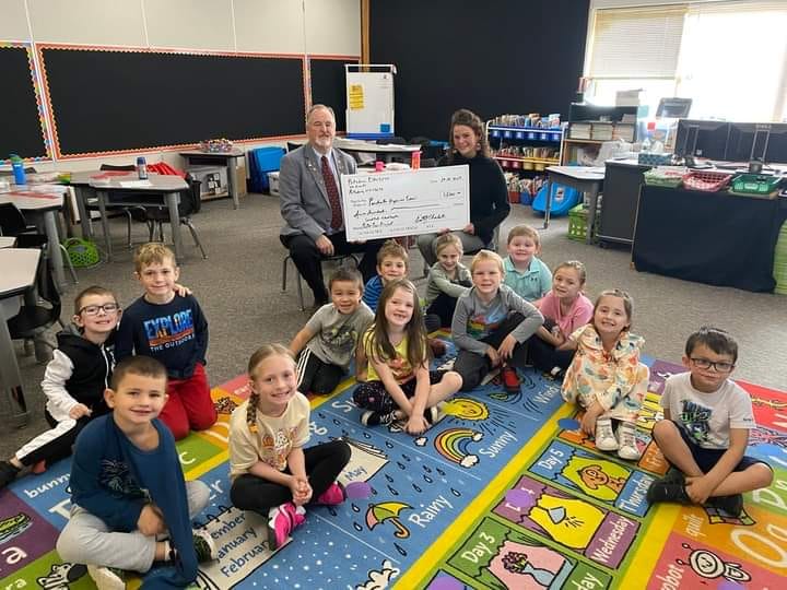 Potsdam Lodge #2074 used the proceeds from an Elks National Foundation Gratitude Grant and donated $500 to the Parishville Hopkinton Panther Paws Project, previously the Snack Pack program. The donation will be used to support the Panther Paws Program with food and school supplies. Chelsea Johnson, who assists with the coordinator of the Panther Paws Program, and first grade students are pictured accepting the donation from Exalted Ruler Ernie Charleston.