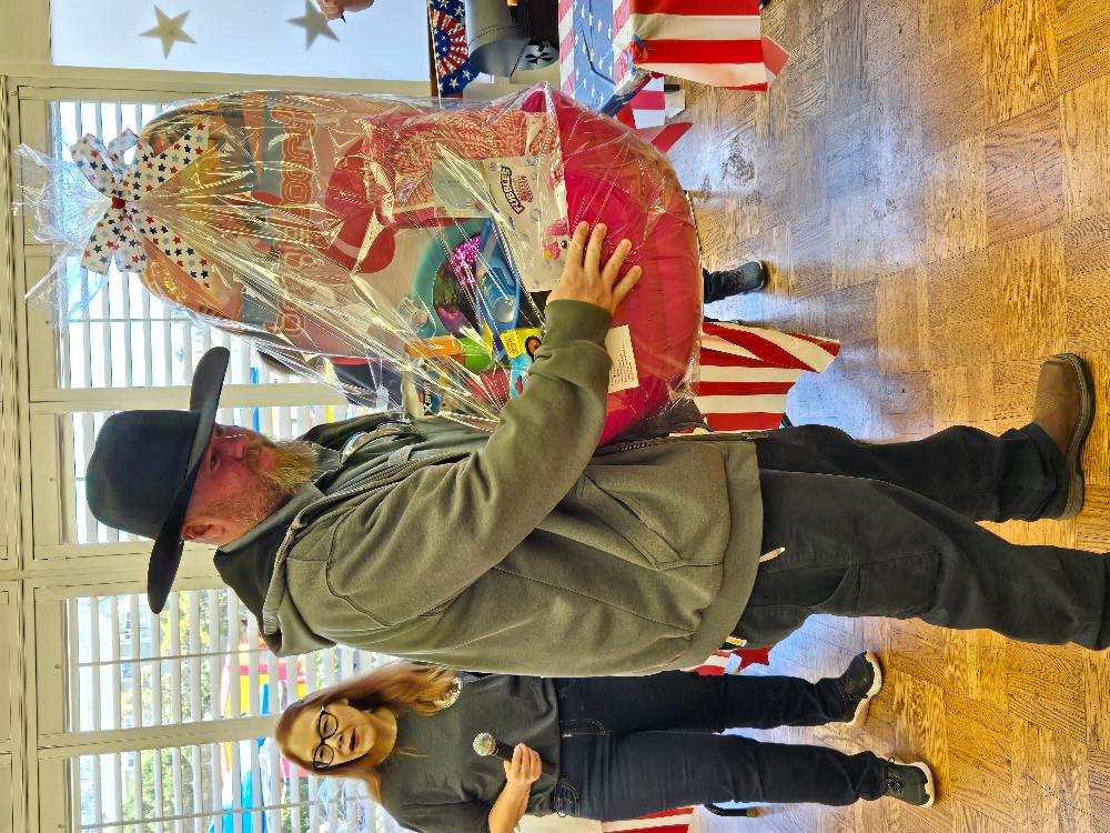 Tommy presenting a basket to a very excited little girl