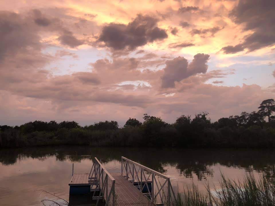 Cloudy sunset over the pier on Jarboe Bayou