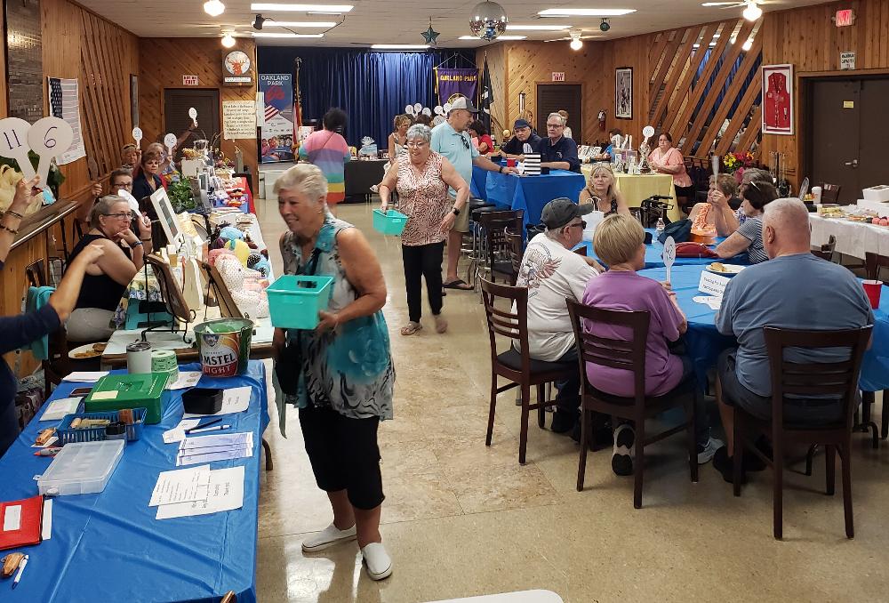 Quarter Auction - Members Dyann Plumeri and Becky Blizzard helping out