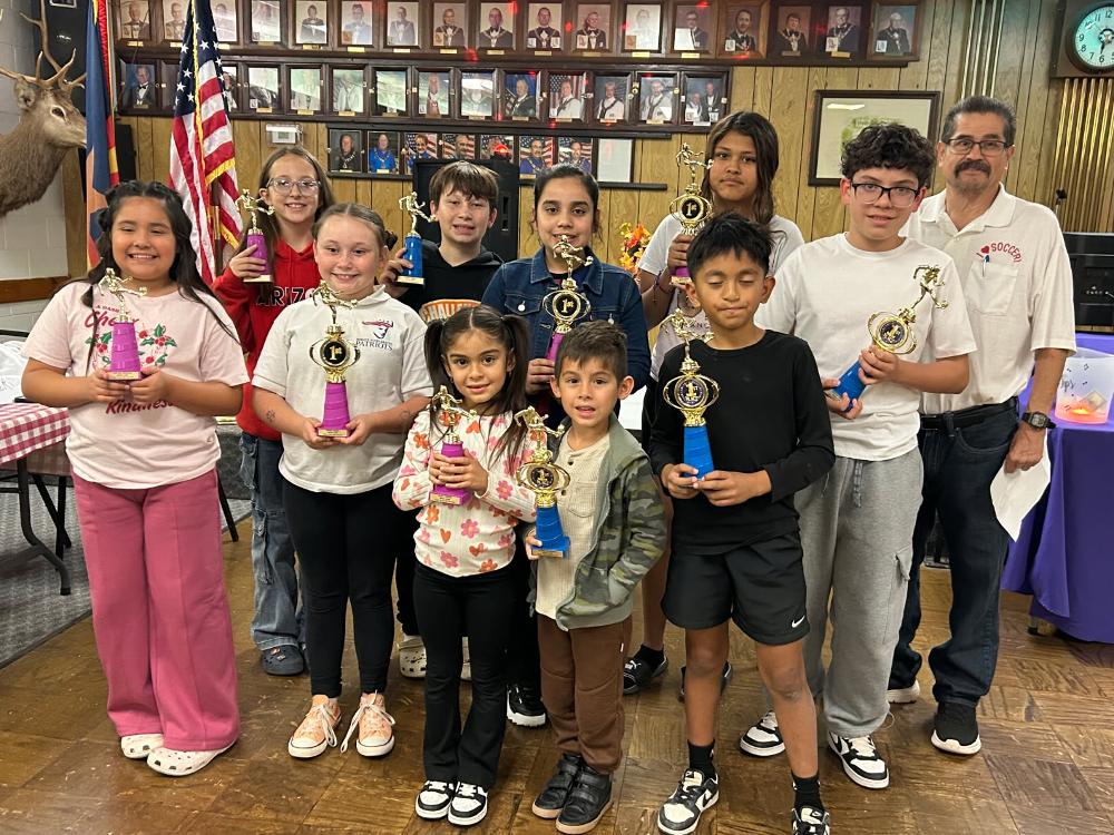 on Saturday November 1st the Bullhead City Elks held their annual soccer shoot at Rotary Park in Bullhead city. 45 kids participated with 11 kids placing first and second place in their respective categories. Picturef left to right front row;U10 2nd place Evelyn Trinidad, U8 girls 1st Pl., Kenna Trebes, U8 girls 2nd place Kassie Ramirez, U8 boys 1st place Oliver O'Connel and U10 boys 1st place  Manny Alamilla. Back row  left to right; U12 girls first place Shayla Clark, U2 girls second  place Edith Stein (not pictured) U10 boys second place  Elijah Trebes, U10 girls first place Miranda Ramirez, U16 girls first Vanessa Sesma and U12 boys first Kristian Medina and soccer shoot chairman Al Luna.