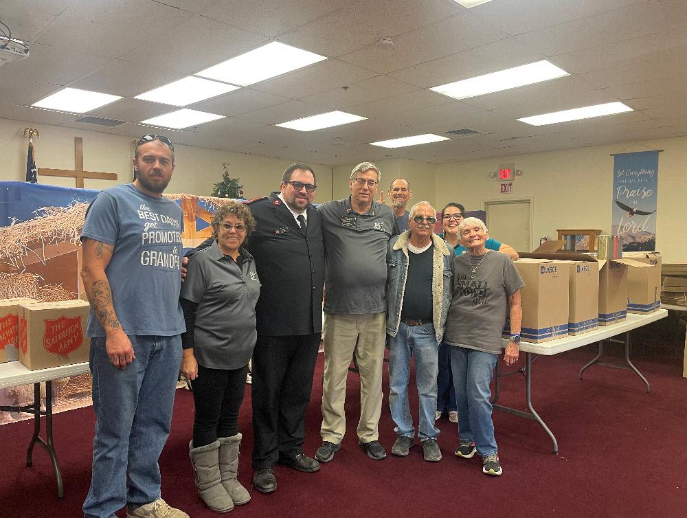 Delivery of Holiday food boxes to Salvation Army. Pictured Elk volunteers and Salvation Army Captain John Birks and ER Walt Honse.