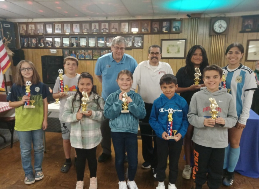 Soccer Shoot  2024 Pictured Left to Right - Back Row Edithe Stein U10, Rolland Robertson U14, ER Walt Honse, Soccar Chairman Al Luna Vanessa Sesma U14 and Ruby Martinez U14. Back Row- Evelyn Trinidad U8, Rylie Roberson U10, Audrien Roldan U10 and Aiden Teague U10. Congratulations!!