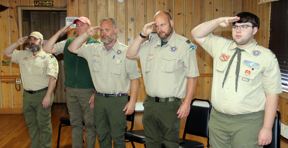 Scout masters from Troop 470 salutes the colors