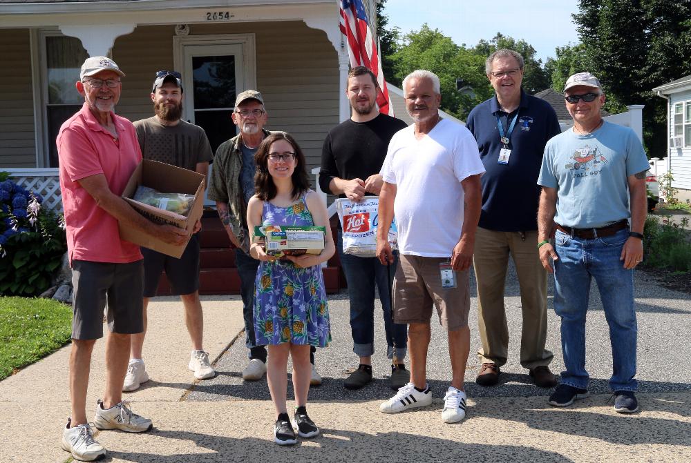  Jaci Narducci, Elks Jude Rich John Tramposch delivering the Prime Rib Dinner to an Islip Vets Beacon house for a a 4th of July feast! The delivery was eagerly except by Beacon house manager, Chris Martin  and several Veterans at a Islip Beacon House.