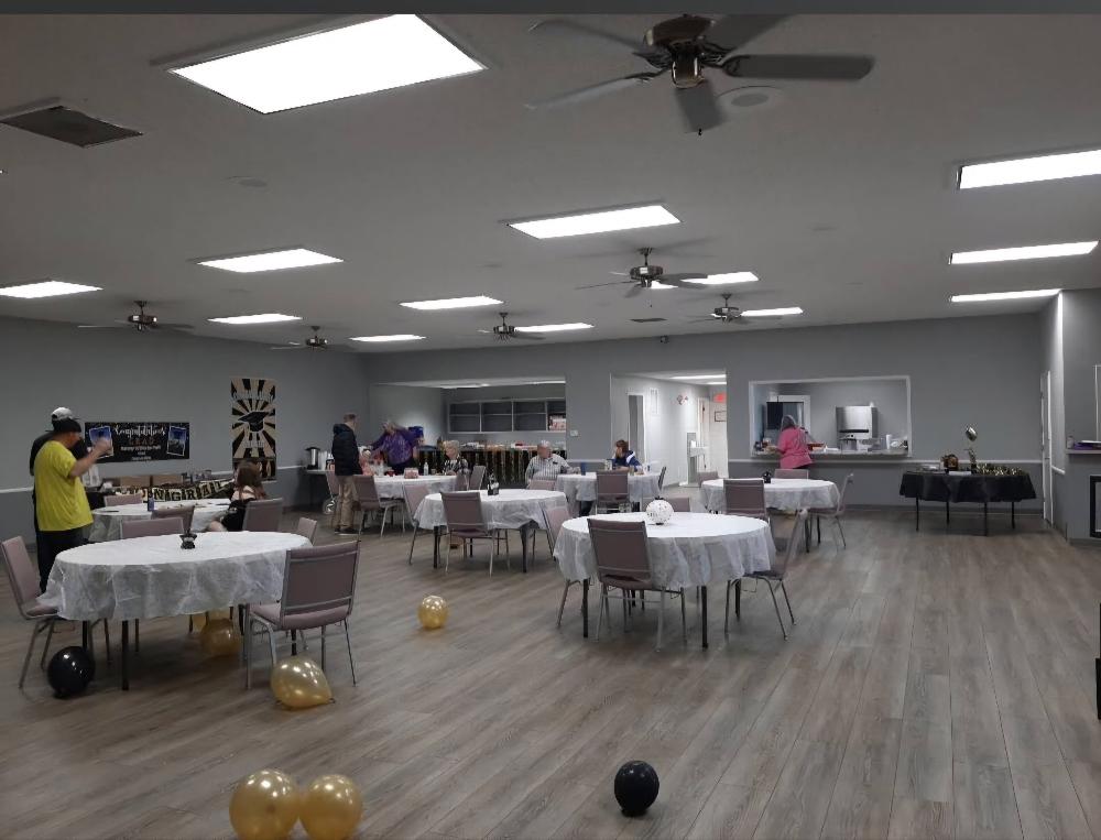 Our Louge is on the left with the Kitchen on the right.  The open space is available for private rentals.